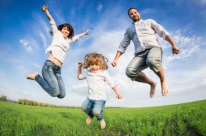Happy active family jumping